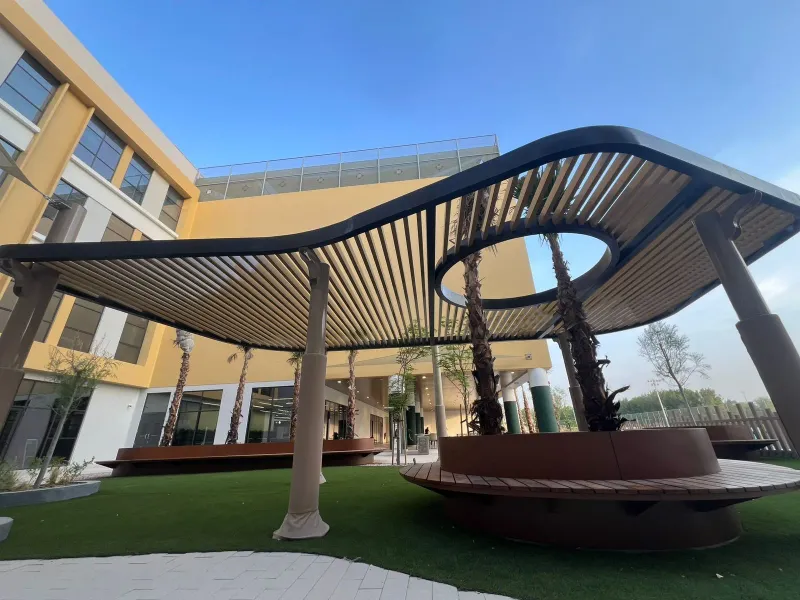 Courtyard pergolas around living trees